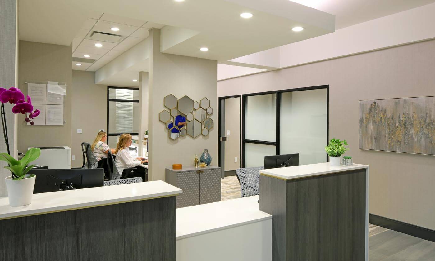 A view of the SkyRidge Dental lobby, with the reception desk shown just around the corner.